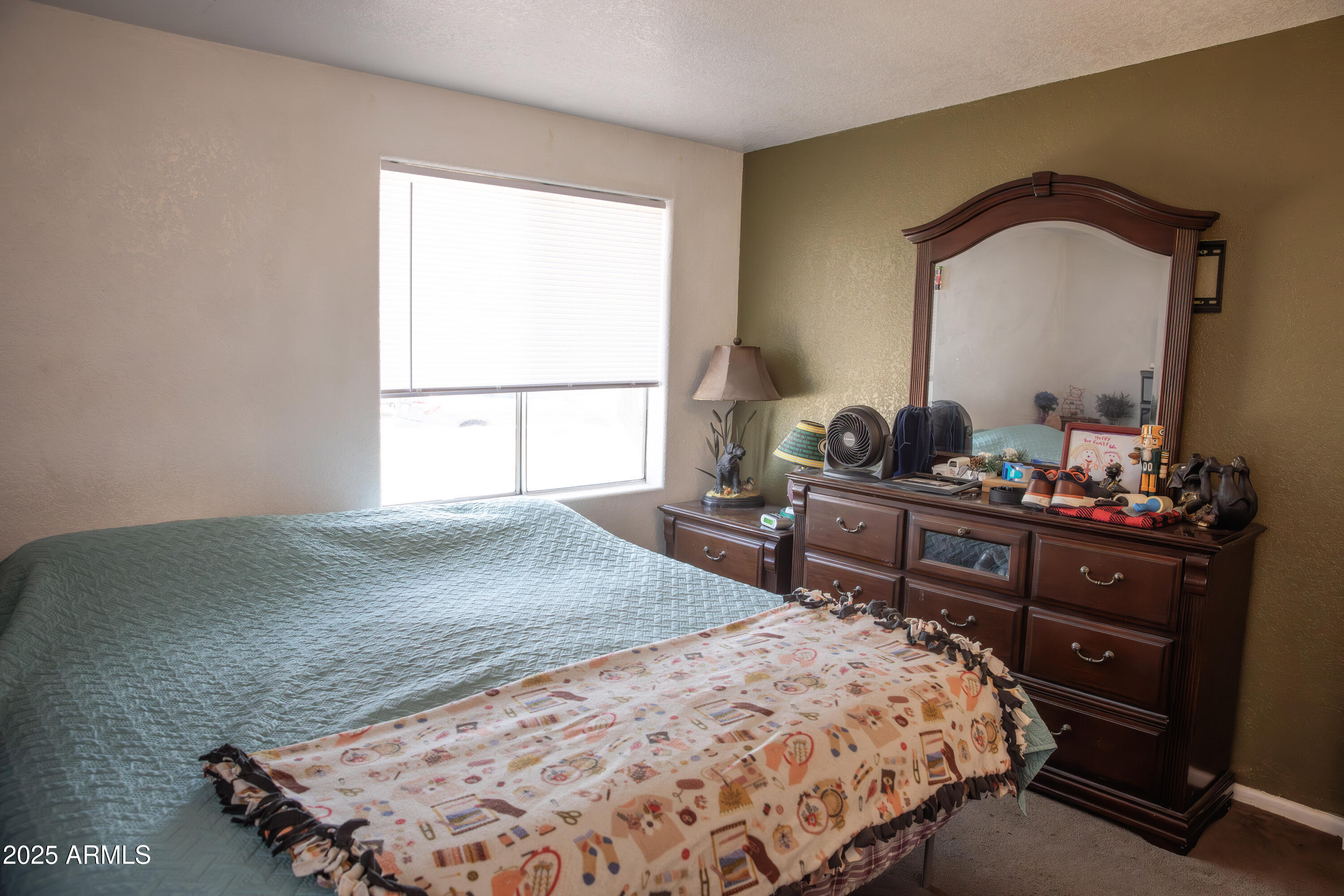 108 Graham Drive Bisbee, AZ 85603 - Photo 42 of 52 a bedroom with a bed and a dresser in it
