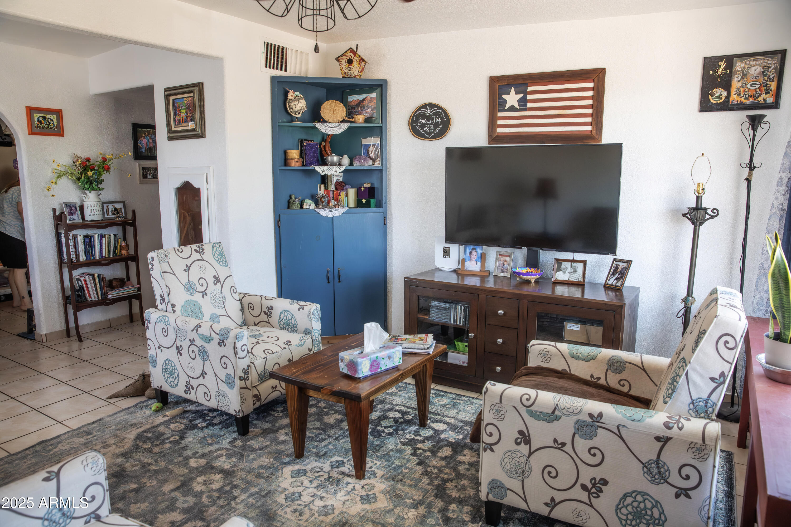 108 Graham Drive Bisbee, AZ 85603 - Photo 52 of 52 a living room with furniture and a flat screen tv