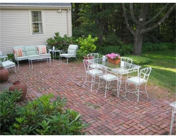 51 Grandview Road Chelmsford, MA 01824 - Photo 4 of 22 a view of a patio with table and chairs potted plants and large tree