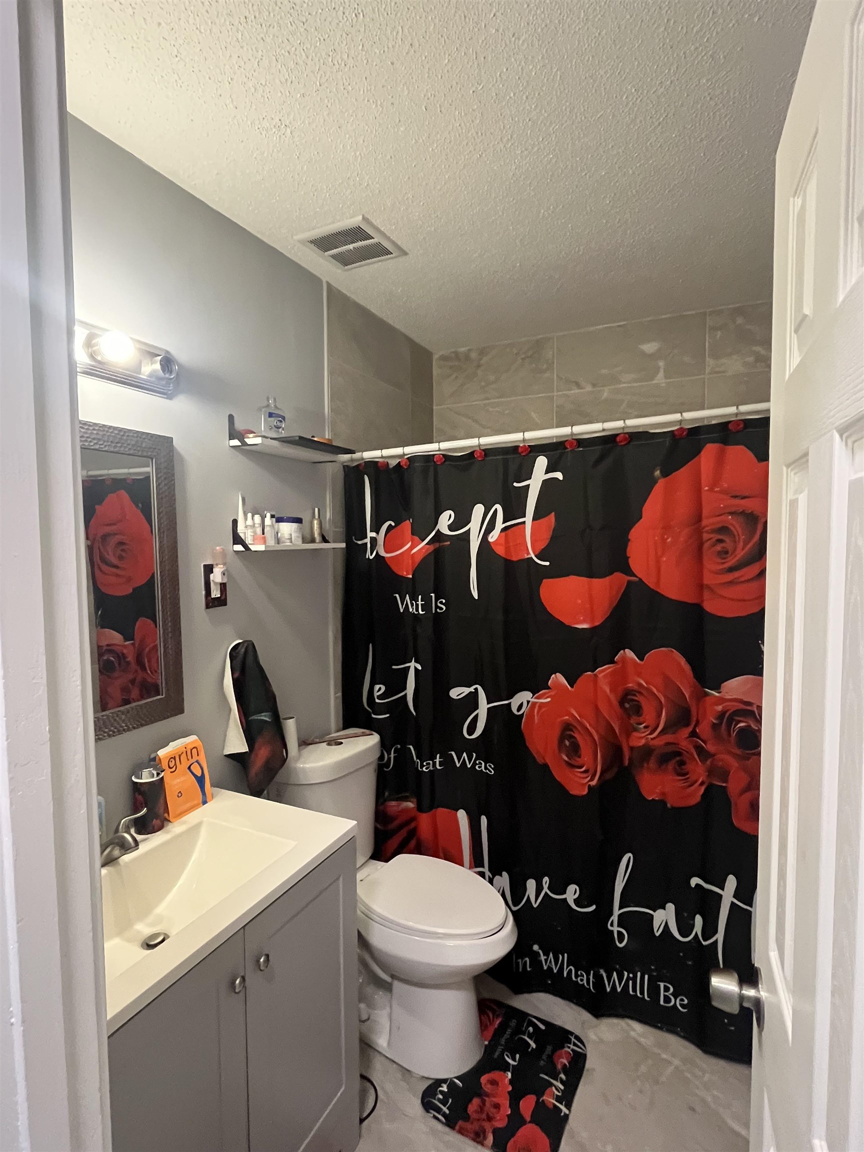 3010 Falkirk Road Memphis, TN 38128 - Photo 7 of 13 Bathroom with vanity, a shower with curtain, a textured ceiling, and concrete floors