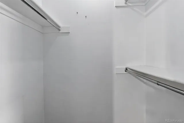 a view of a room with racks on the wall