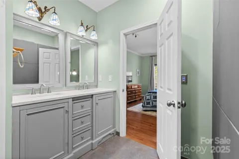 a spacious bathroom with a shower and a sink