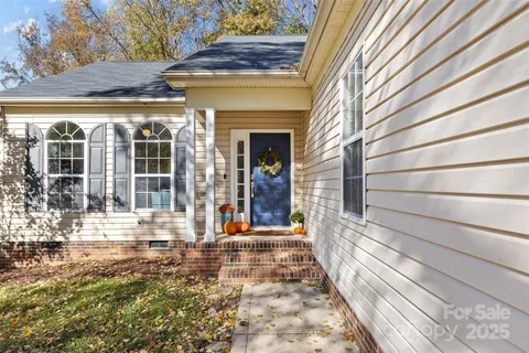 a view of a brick house with a large window