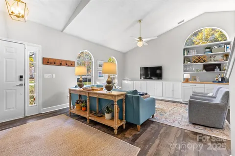 a view of living room with furniture and a flat screen tv