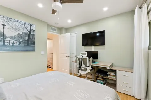 a bedroom with a workspace