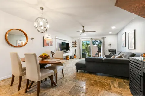 a living room with fireplace furniture and a window