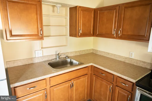 a kitchen with a sink and cabinets