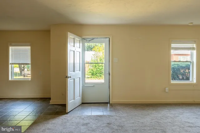 an empty room with windows