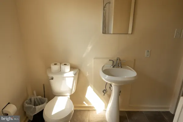 a bathroom with a bathtub and a window