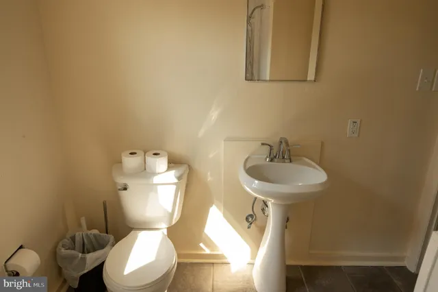a bathroom with a bathtub and a window