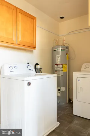 a view of a livingroom with an empty space and a window