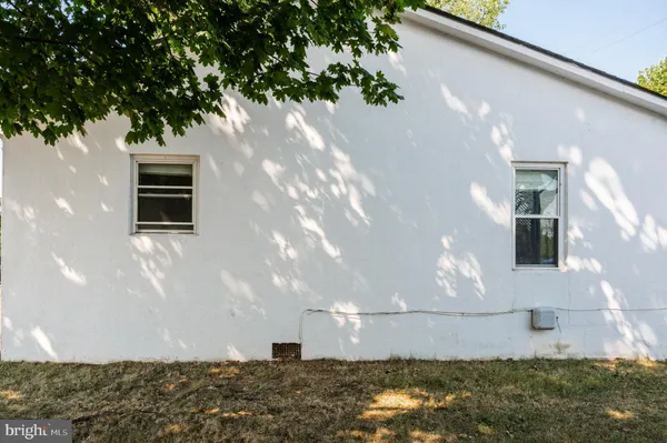 a view of an empty room with closet