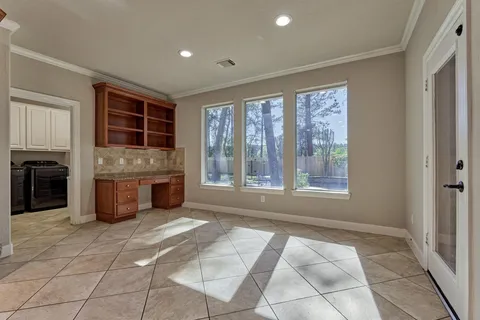 a spacious bedroom with a large bed and a window