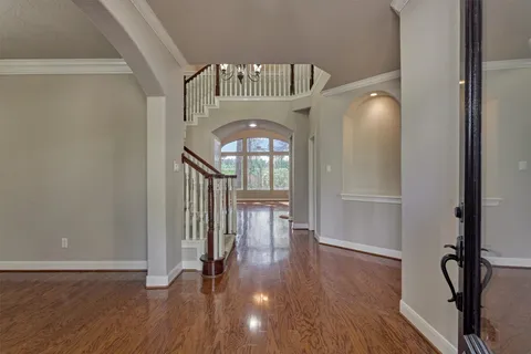 a view of entryway with wooden floor
