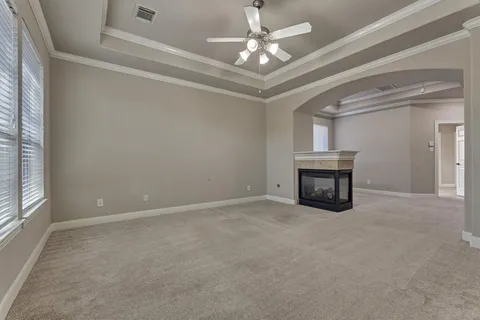 a view of empty room with fireplace