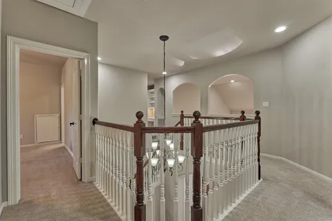 a view of a hallway view with staircase