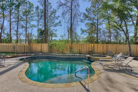 a view of a swimming pool with a patio