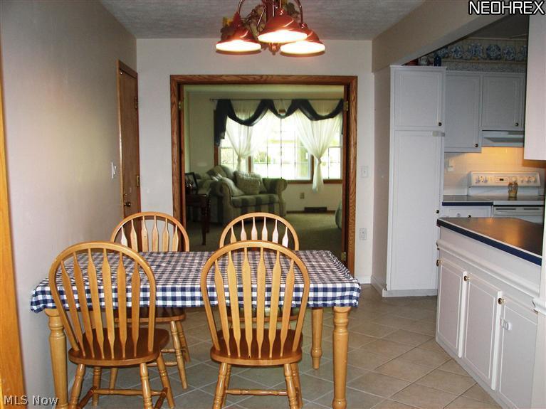 3282 Brenner Road Barberton, OH 44203 - Photo 7 of 24 Light and Airy Flow from Living Room through Kitchen.