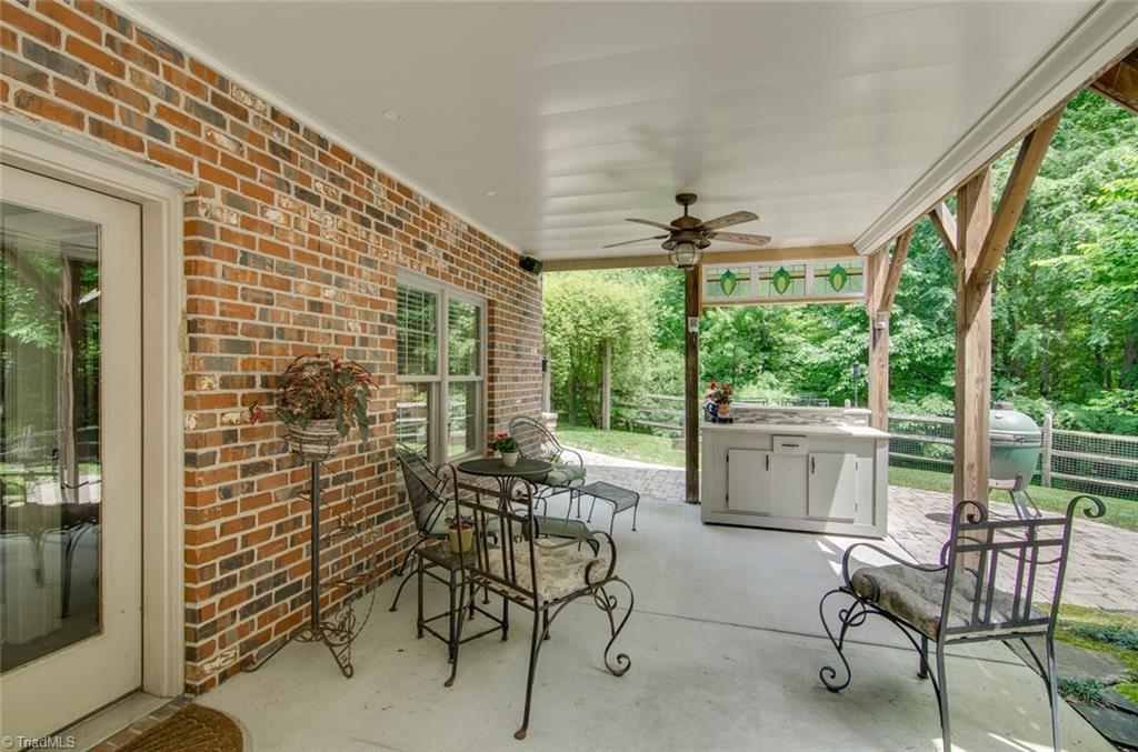 5032 Bennington Way High Point, NC 27262 - Photo 23 of 30 Lower level patio with built-in granite top bar