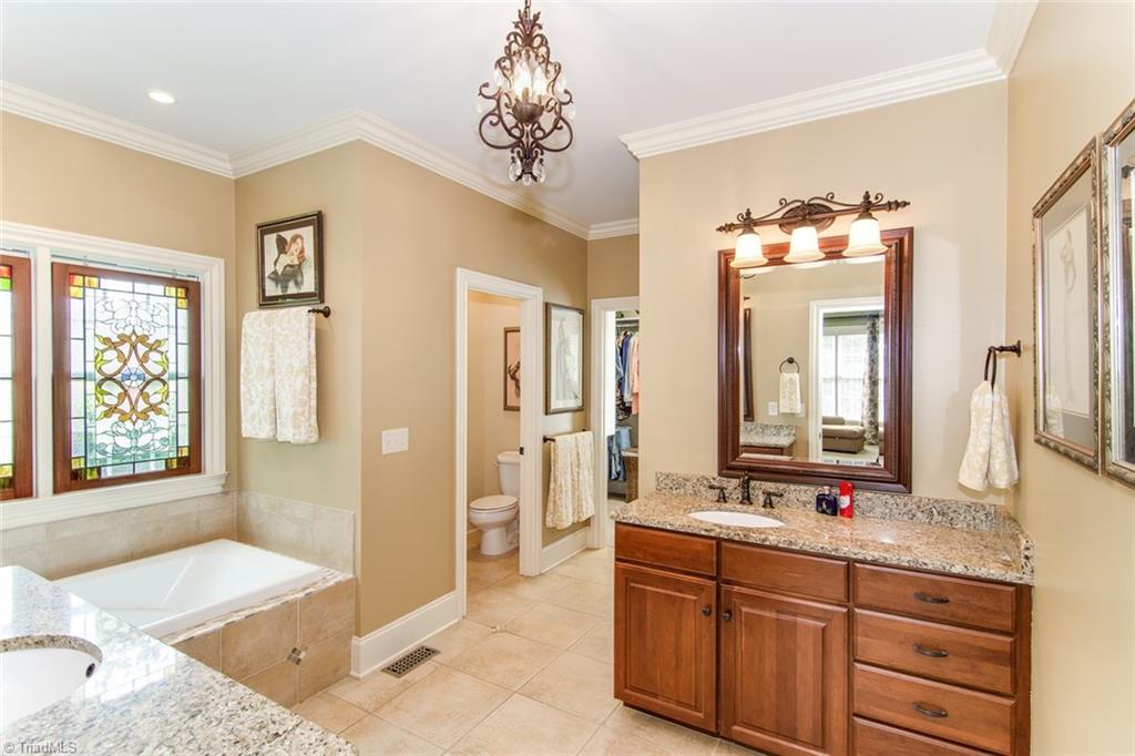 5032 Bennington Way High Point, NC 27262 - Photo 7 of 30 Master bath with view into master closet. Double vanities and walk-in shower.