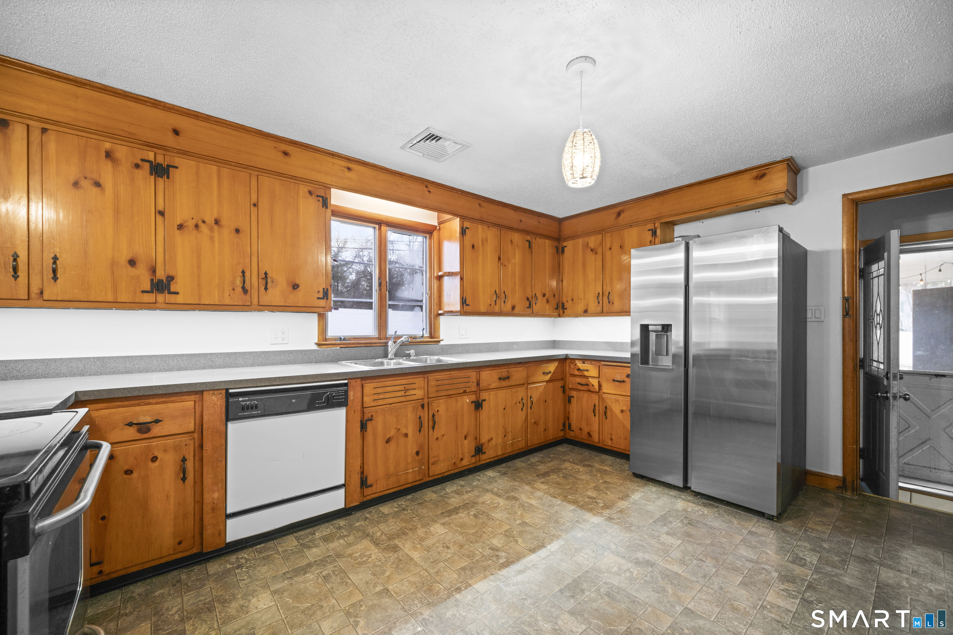 514 Hilliard Street Manchester, CT 06042 - Photo 15 of 38 a large kitchen with stainless steel appliances granite countertop a refrigerator a sink dishwasher a stove and a refrigerator