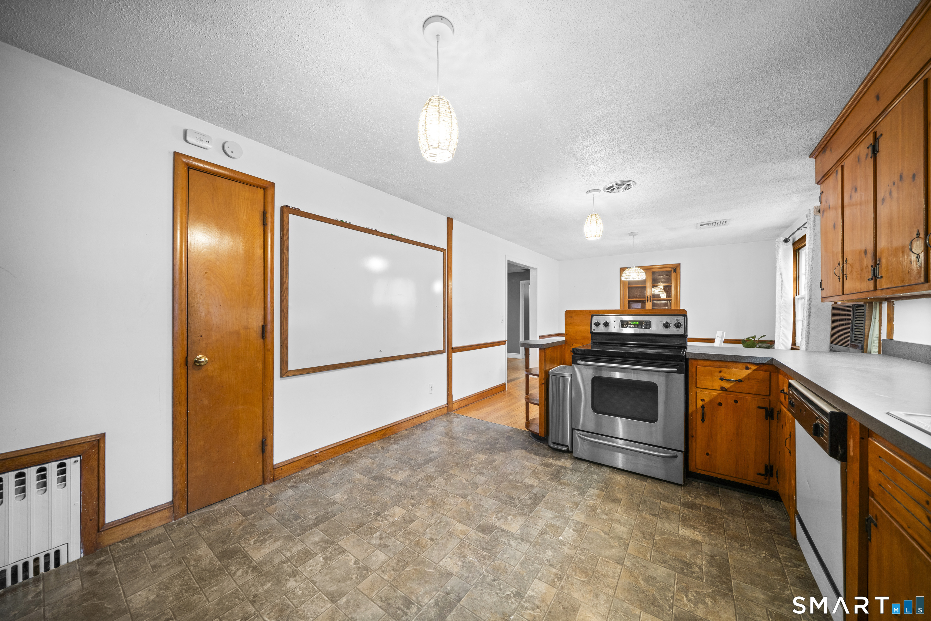 514 Hilliard Street Manchester, CT 06042 - Photo 17 of 38 a kitchen with stainless steel appliances granite countertop a refrigerator a stove and a sink