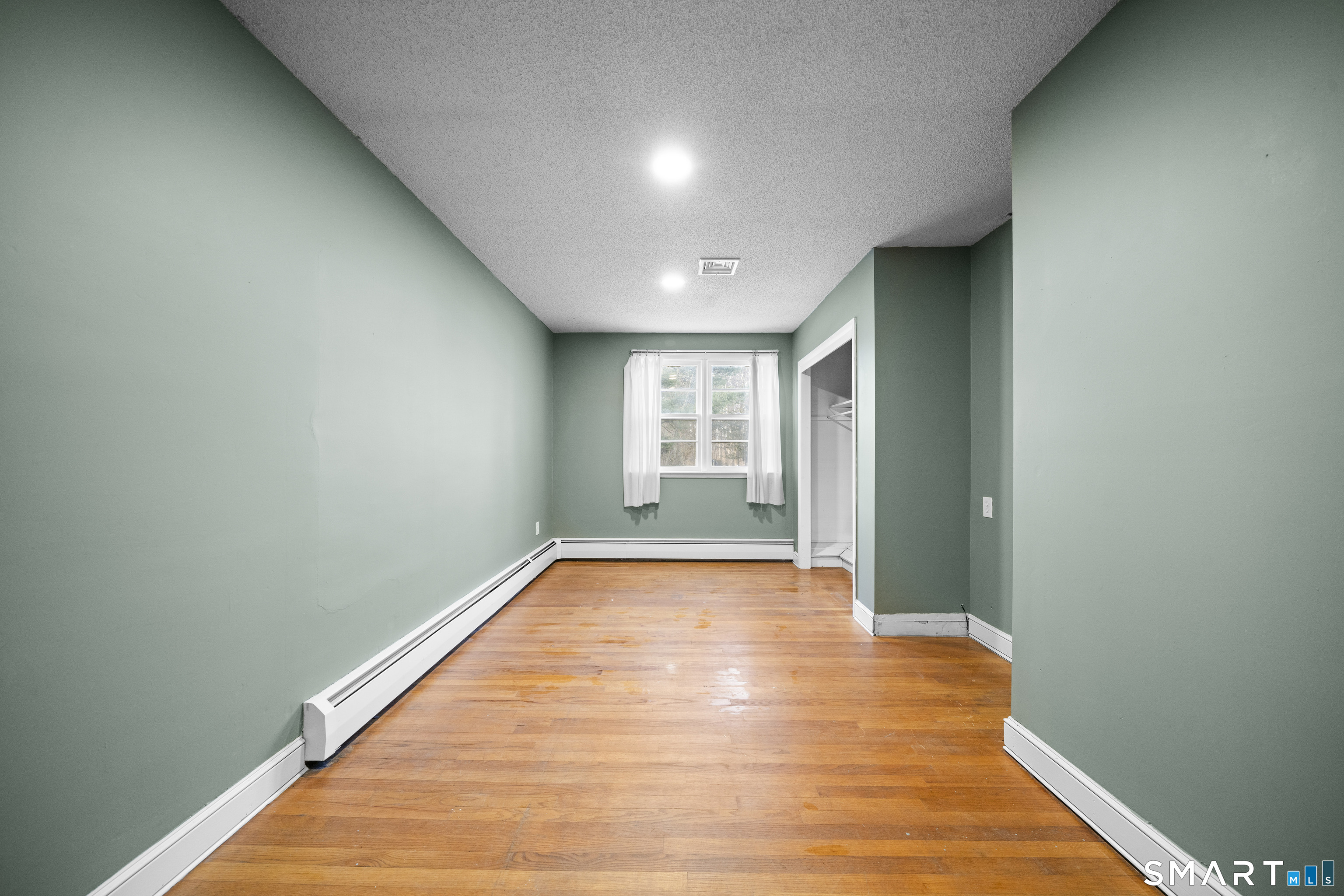 514 Hilliard Street Manchester, CT 06042 - Photo 18 of 38 a view of an empty room and window