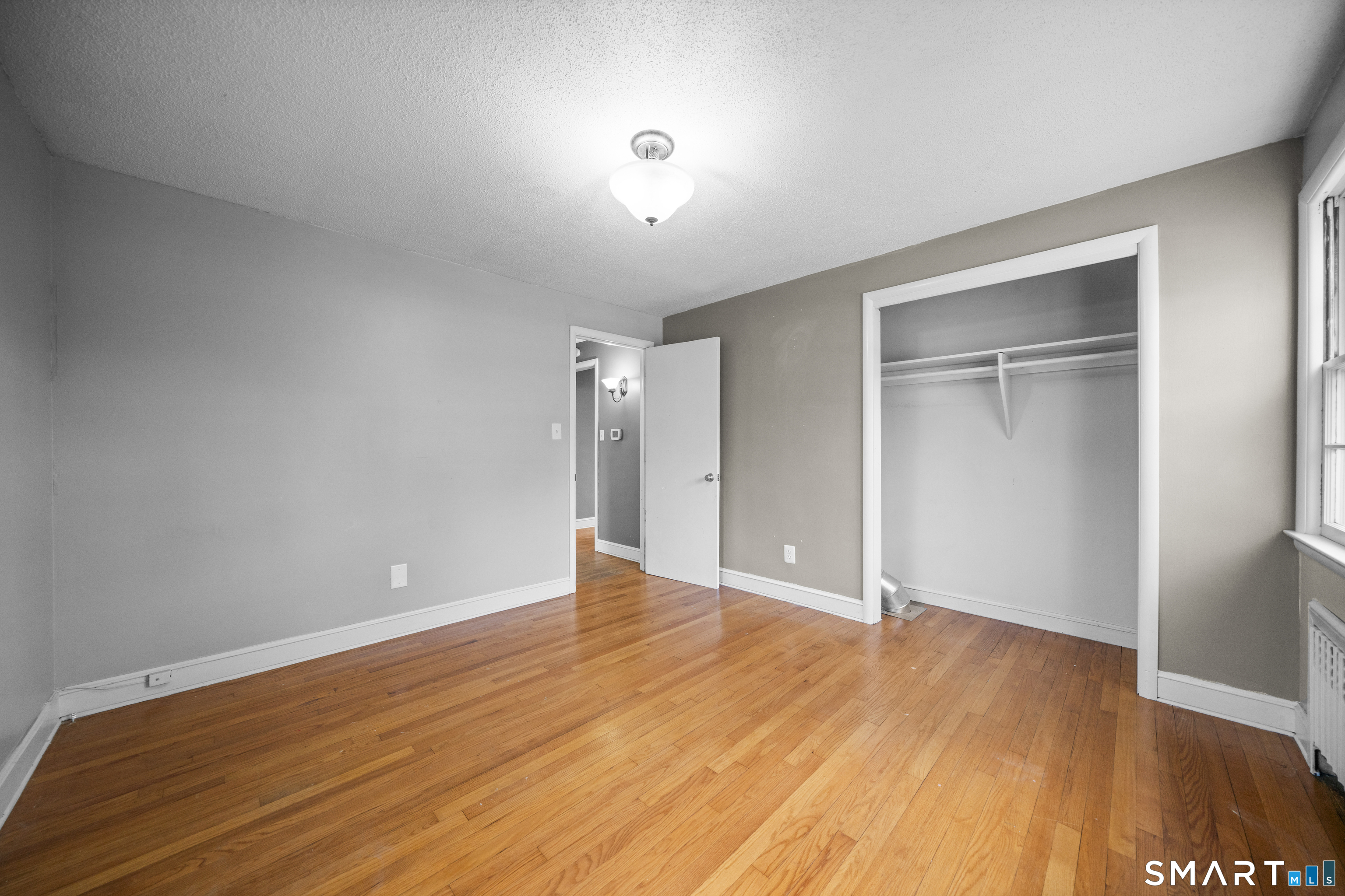 514 Hilliard Street Manchester, CT 06042 - Photo 26 of 38 a view of an empty room with wooden floor