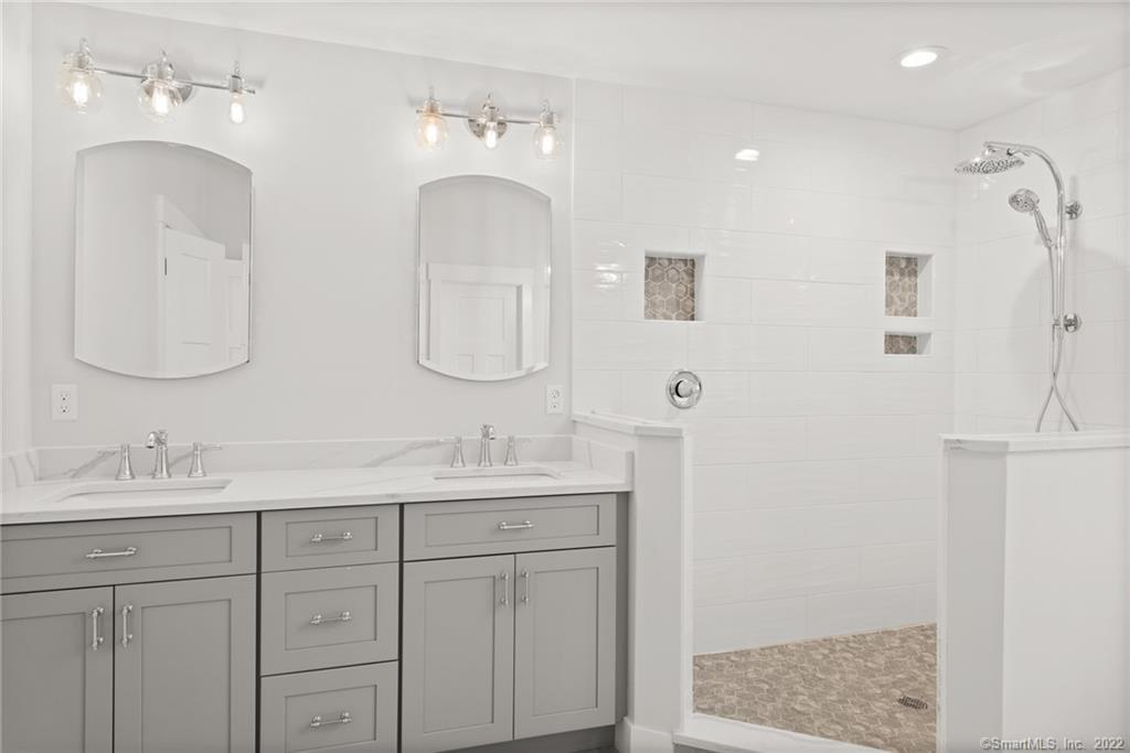 114 Daniel Trace Burlington, CT 06013 - Photo 13 of 30 a bathroom with a double vanity sink and mirror