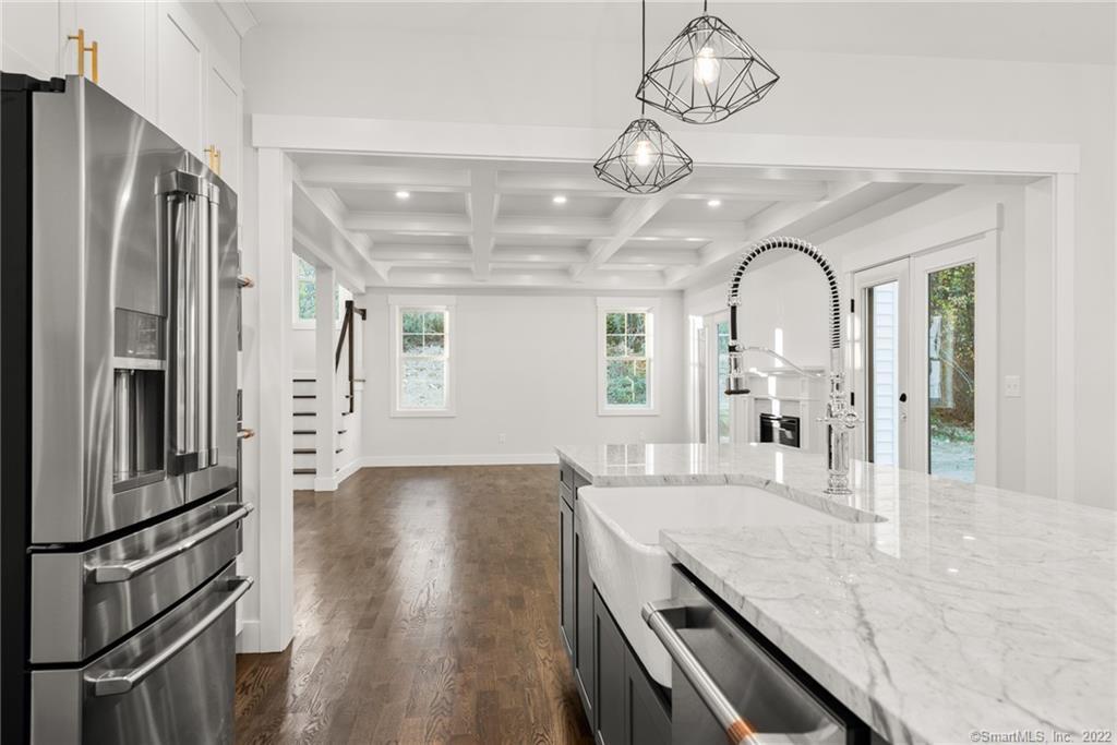 114 Daniel Trace Burlington, CT 06013 - Photo 25 of 30 a view of a kitchen with a sink and refrigerator