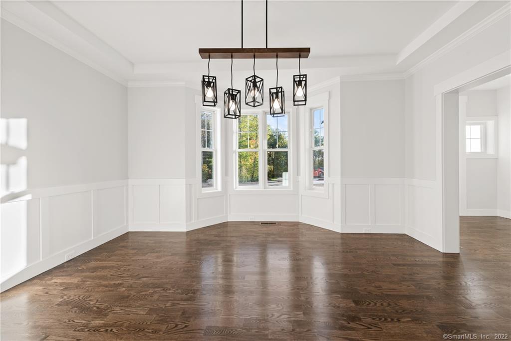 114 Daniel Trace Burlington, CT 06013 - Photo 29 of 30 a view of empty room with wooden floor and fan