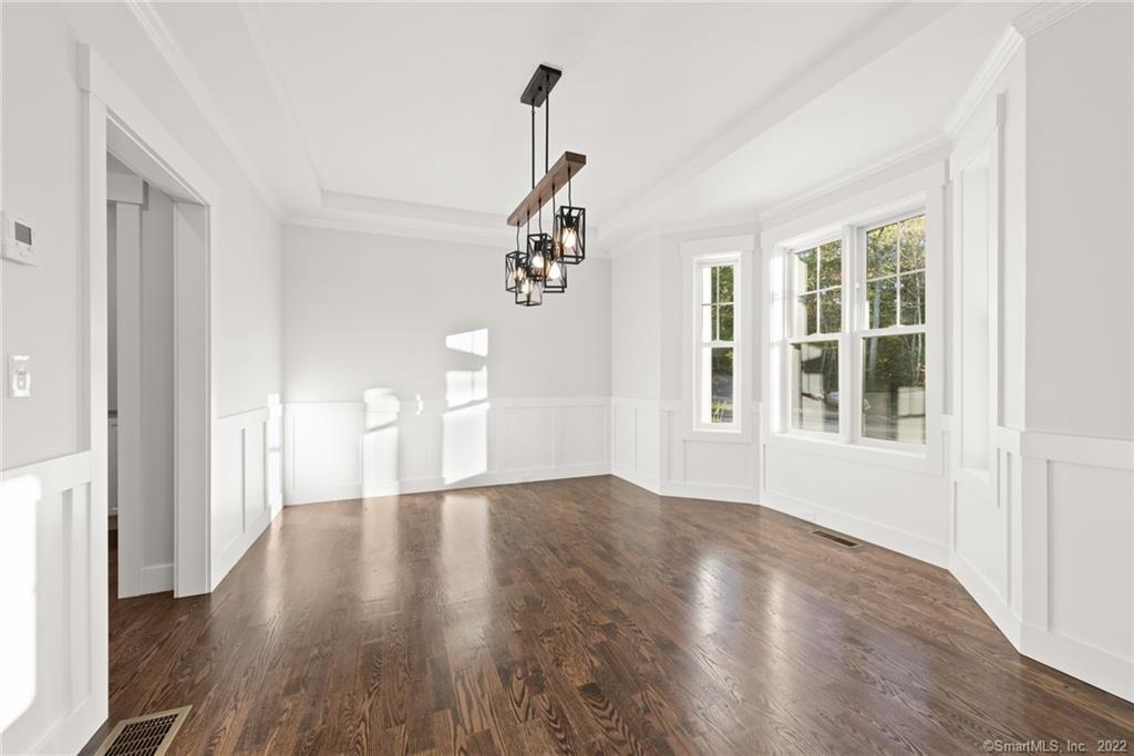 114 Daniel Trace Burlington, CT 06013 - Photo 30 of 30 a view of empty room with wooden floor and fan