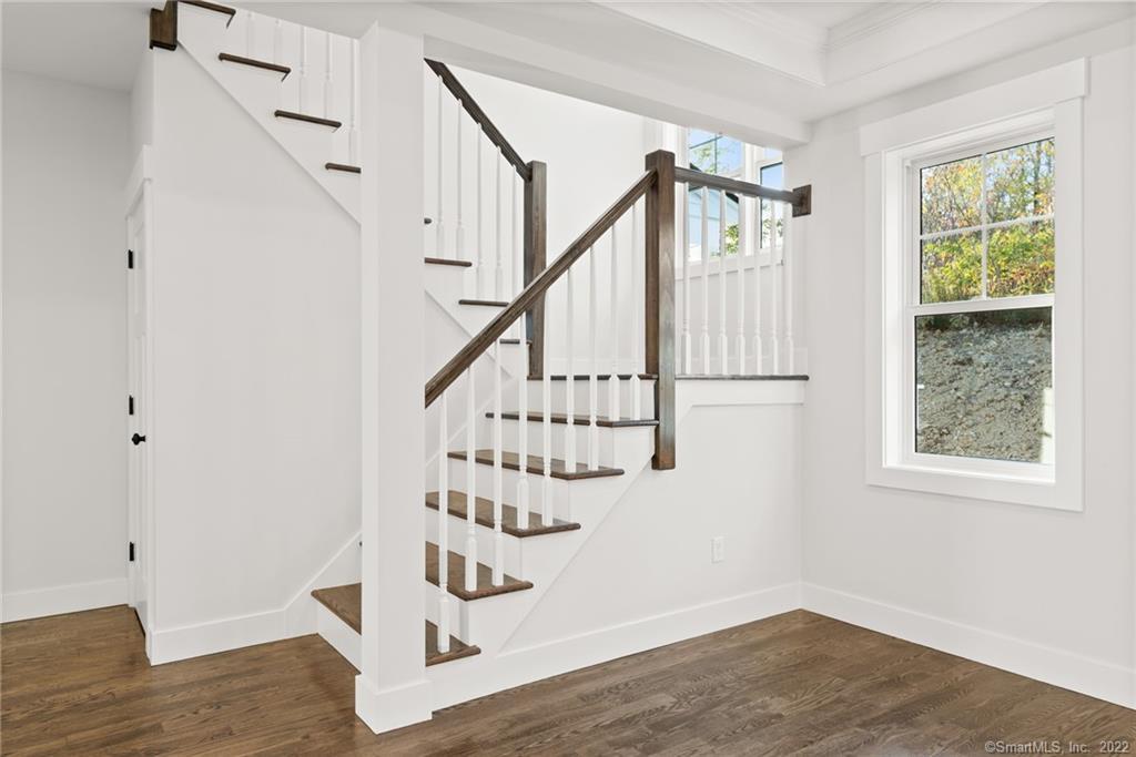 114 Daniel Trace Burlington, CT 06013 - Photo 5 of 30 a view of entryway with wooden floor and stairs