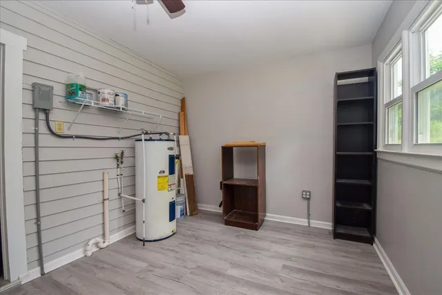 a view of an entryway with wooden floor and a window