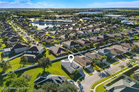 an aerial view of residential houses with outdoor space