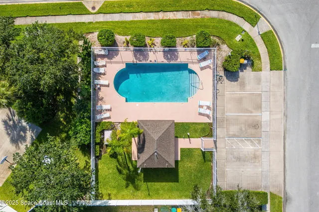 an aerial view of a house with a garden