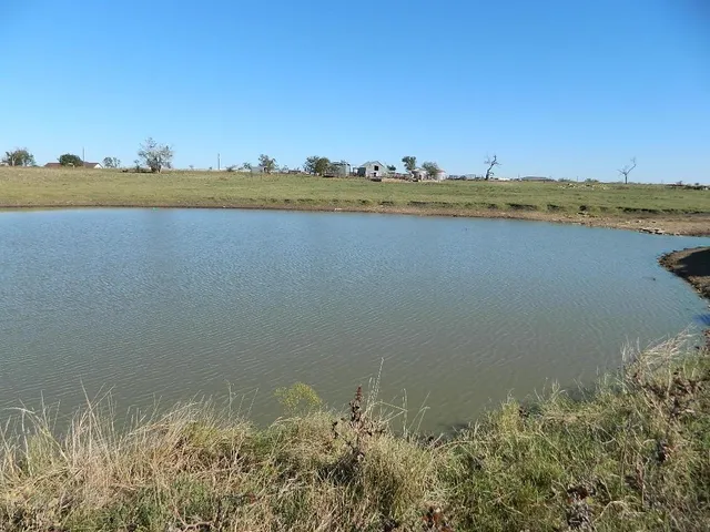 a bathroom with a granite countertop sink and vanity
