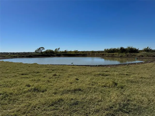 a view of a lake with beach