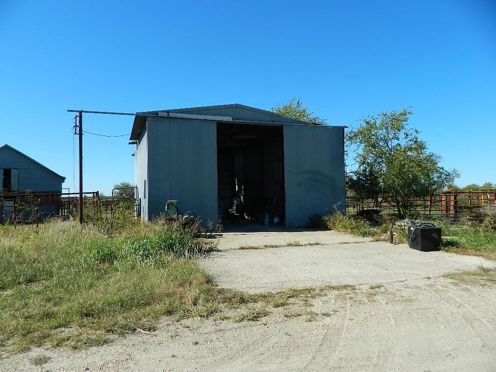 2435 County Road 247 Valley View, TX 76272 - Photo 3 of 40 a backyard of a house with garage and outdoor seating