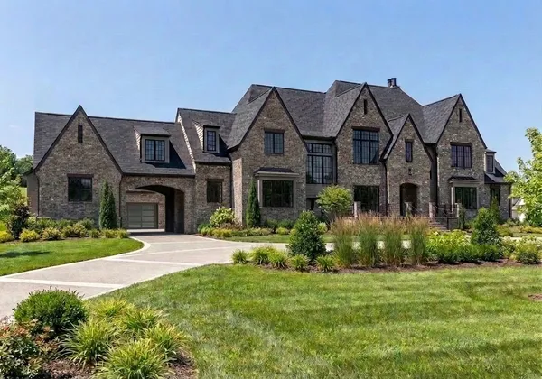 a view of a house with large windows