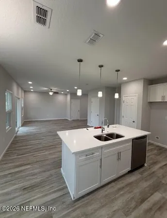 a view of a floor to ceiling window and a yard