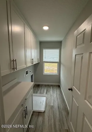 a spacious bathroom with a shower sink and mirror