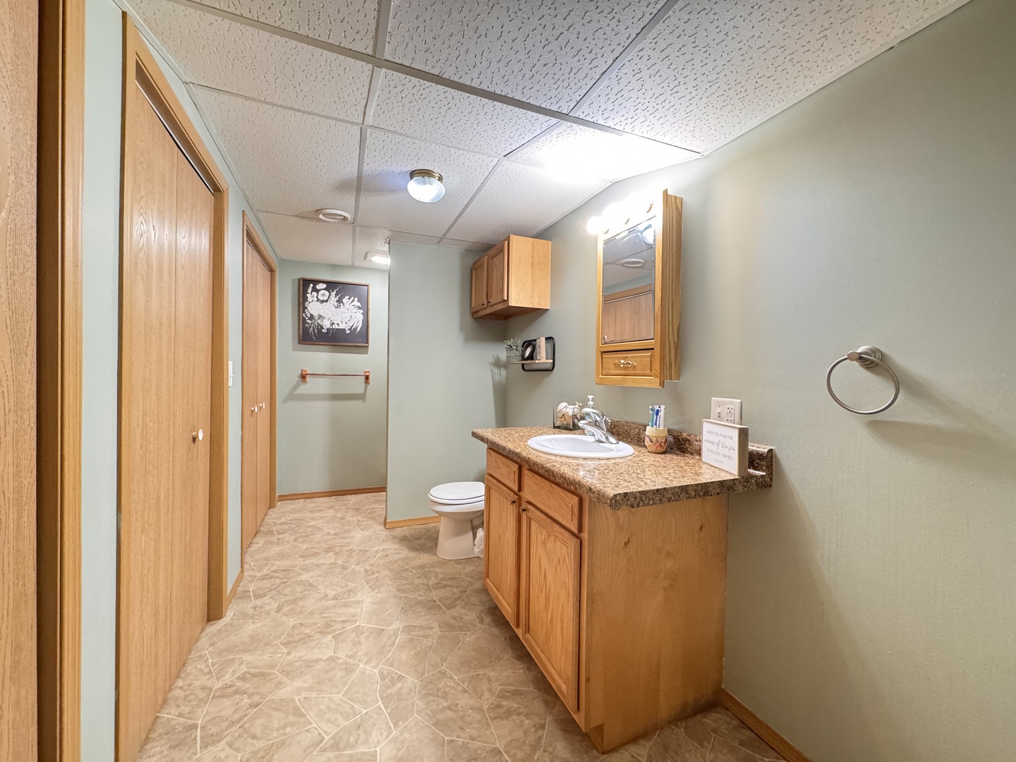 402 Woodside Place Dixon, IL 61021 - Photo 14 of 17 a view of a bathroom with a sink and mirror