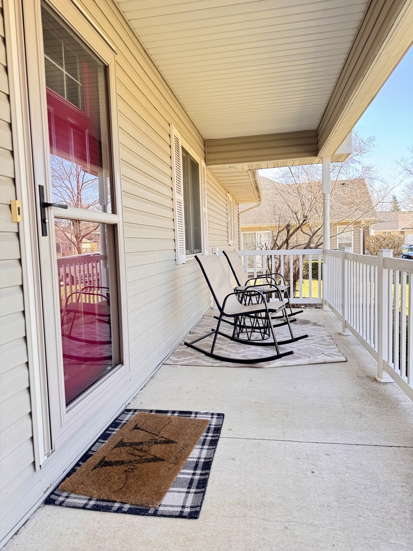 402 Woodside Place Dixon, IL 61021 - Photo 2 of 17 a view of roof deck with dining table and chairs with wooden floor