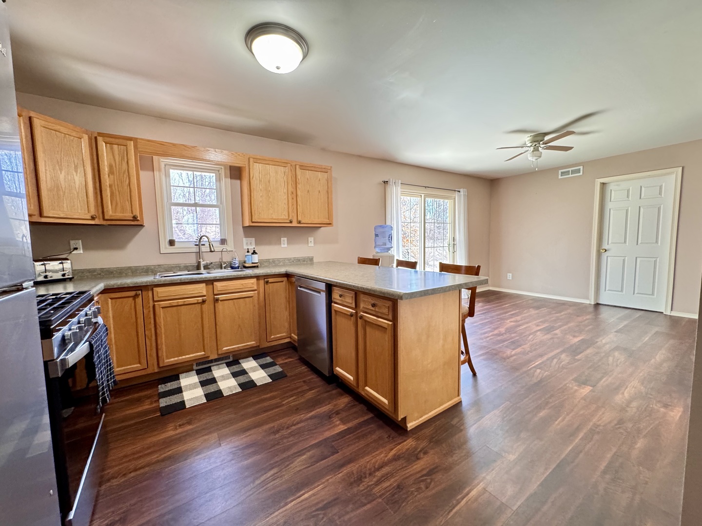 402 Woodside Place Dixon, IL 61021 - Photo 5 of 17 a kitchen with a sink window and cabinets
