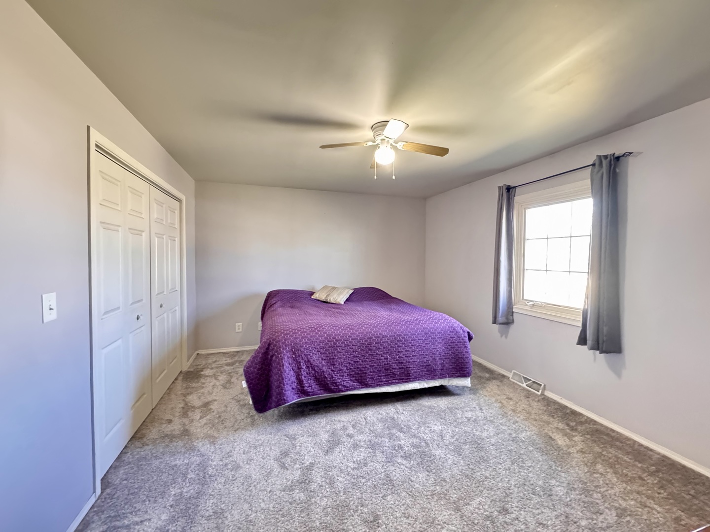 402 Woodside Place Dixon, IL 61021 - Photo 7 of 17 a spacious bedroom with a bed and a chandelier