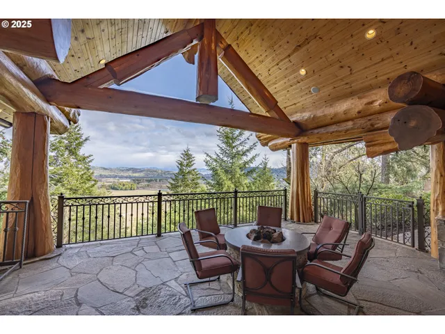 a view of a chair and table in the balcony