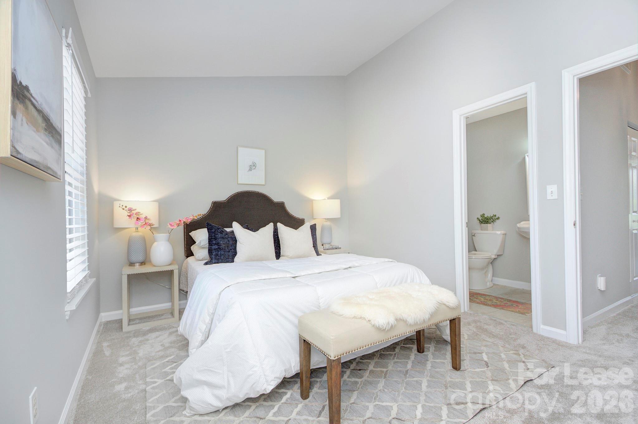 8268 Golf Ridge Drive Charlotte, NC 28277 - Photo 17 of 24 a bedroom with a bed and a mirror