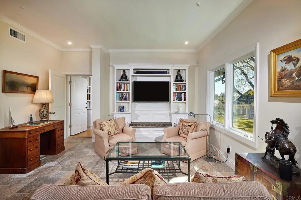 4613 Sun Valley Road Del Mar, CA 92014 - Photo 15 of 55 a living room with furniture a flat screen tv and a large window