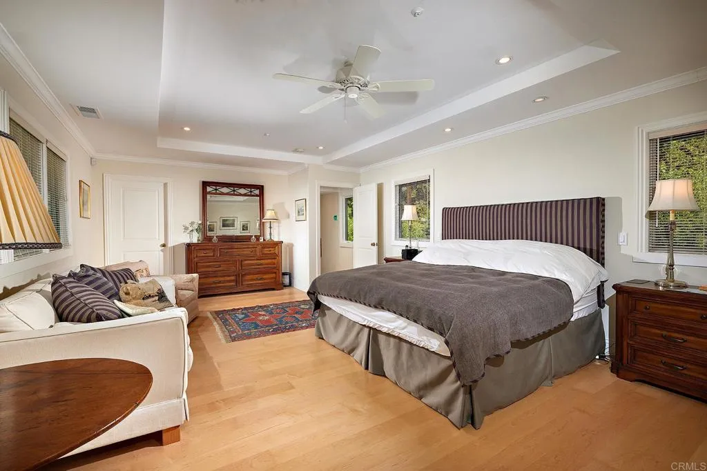 4613 Sun Valley Road Del Mar, CA 92014 - Photo 17 of 55 a bedroom with a bed couch and window